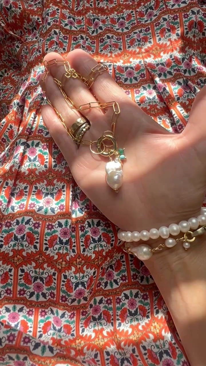 TSJ gold-tone chain necklace with baroque pearl charm and bracelet set. Features unique freshwater pearls and gold rings.
