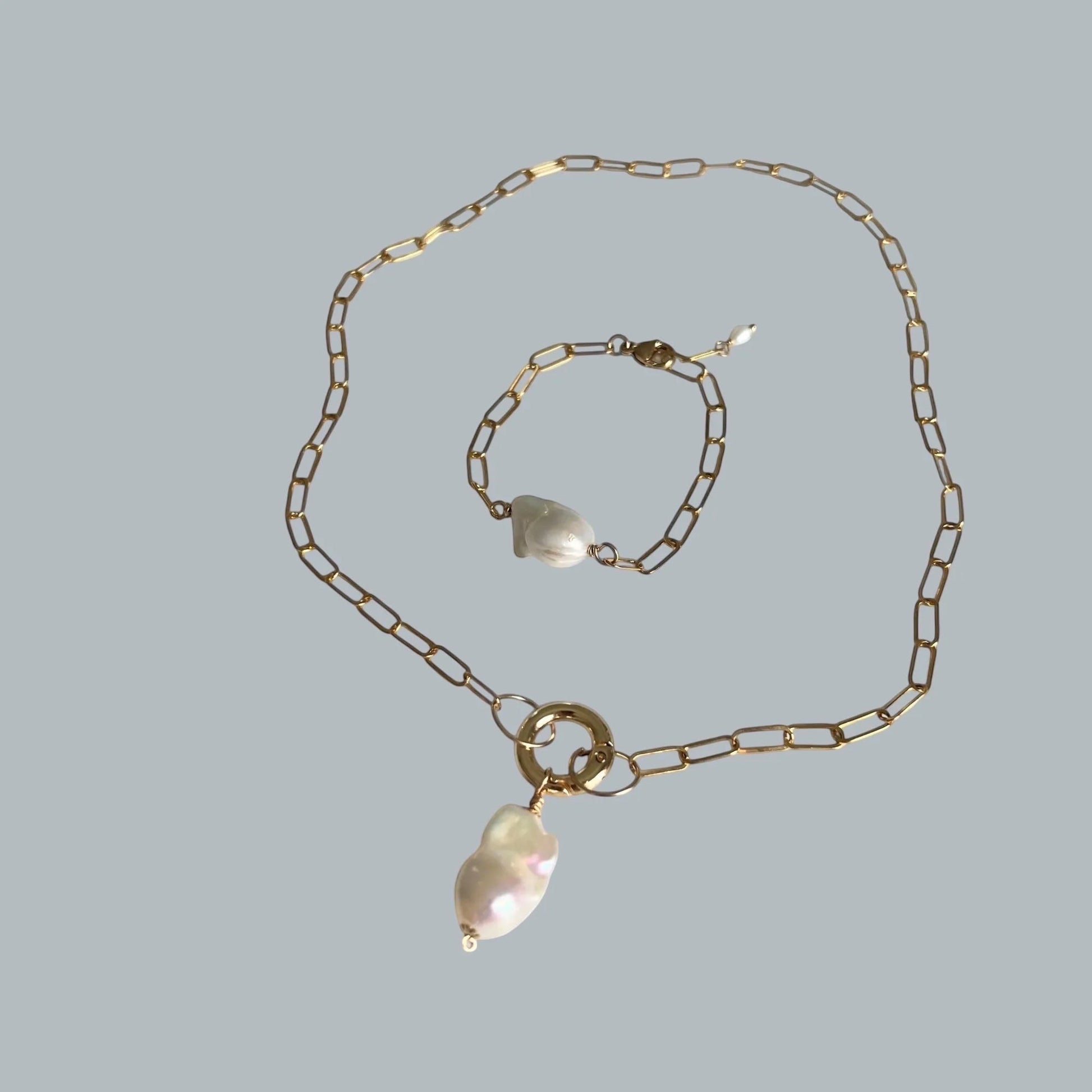 TSJ gold-tone chain necklace and bracelet set with baroque freshwater pearls and gold ring accent.