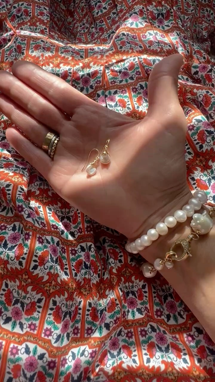 TSJ gold-tone wire-wrapped freshwater pearl drop earrings with baroque pearls.