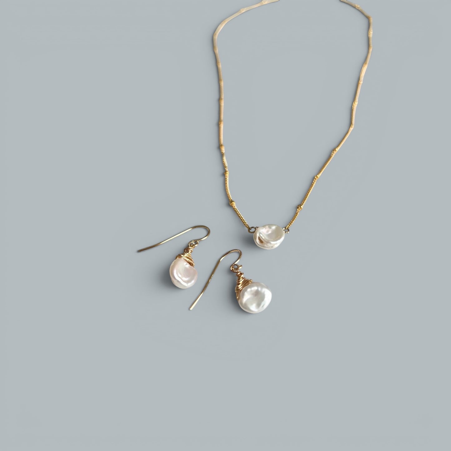 TSJ gold-tone wire-wrapped baroque freshwater pearl drop earrings and matching necklace.