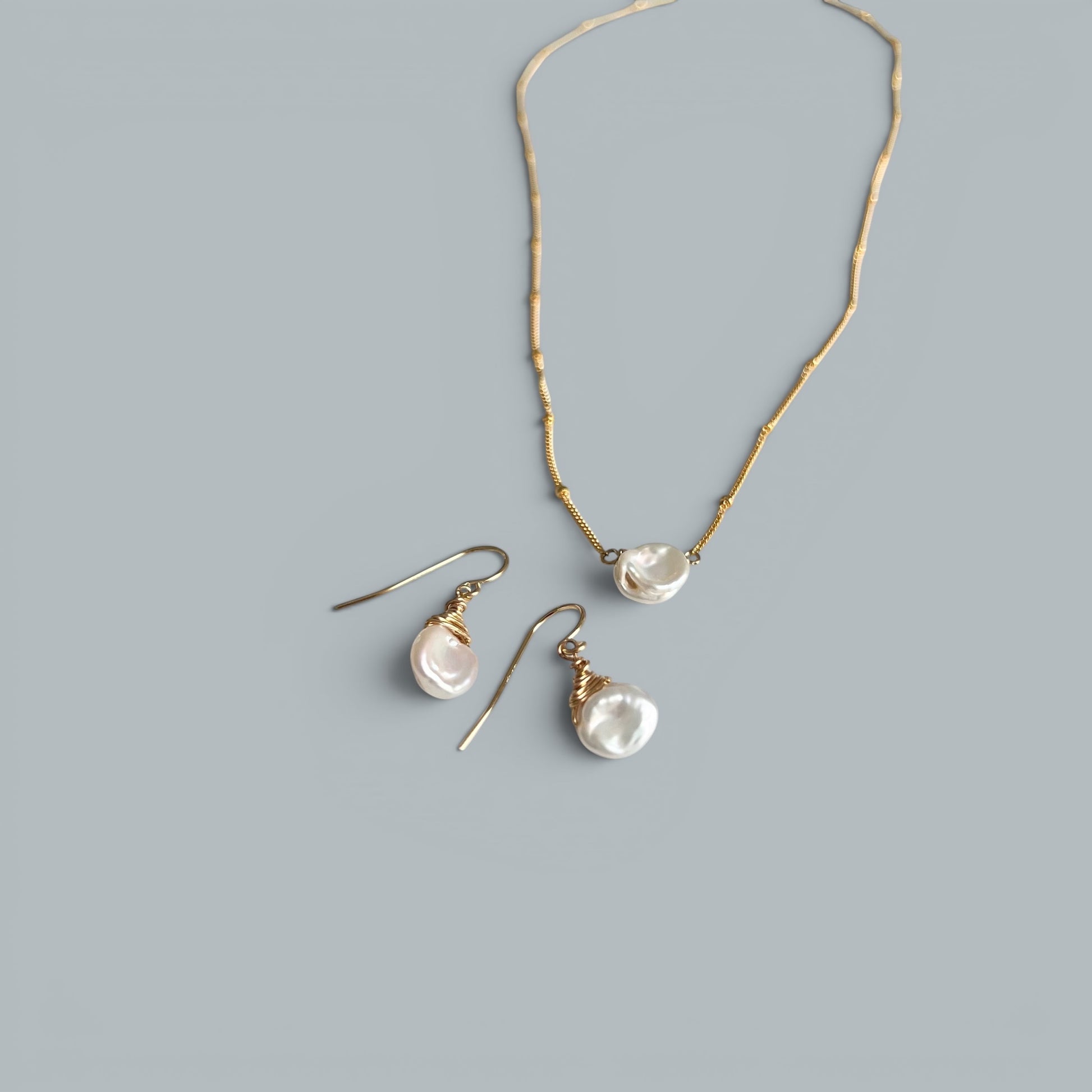 TSJ gold-tone wire-wrapped baroque freshwater pearl drop earrings and matching necklace.