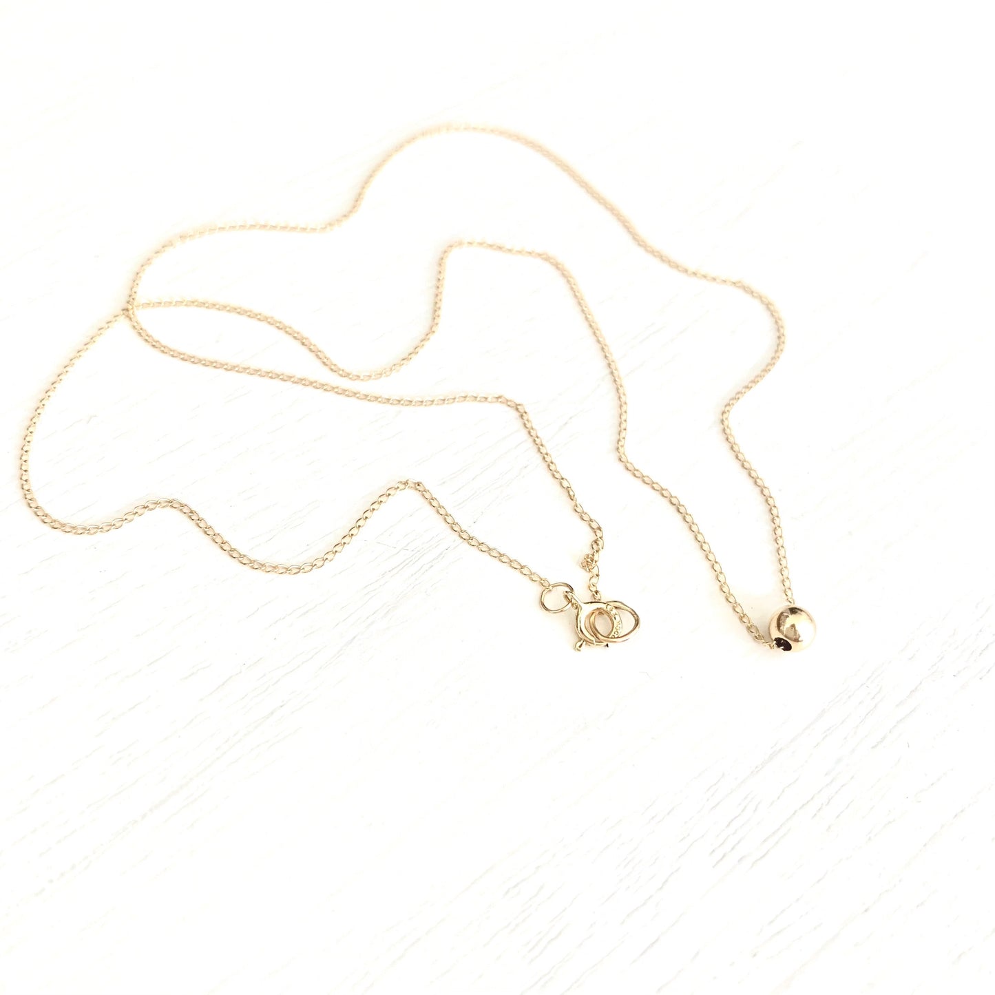 Betty single gold ball necklace