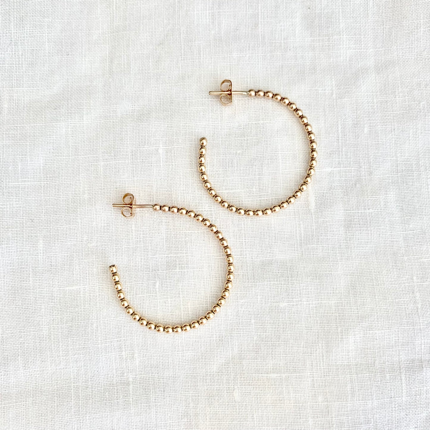 Lila beaded hoops