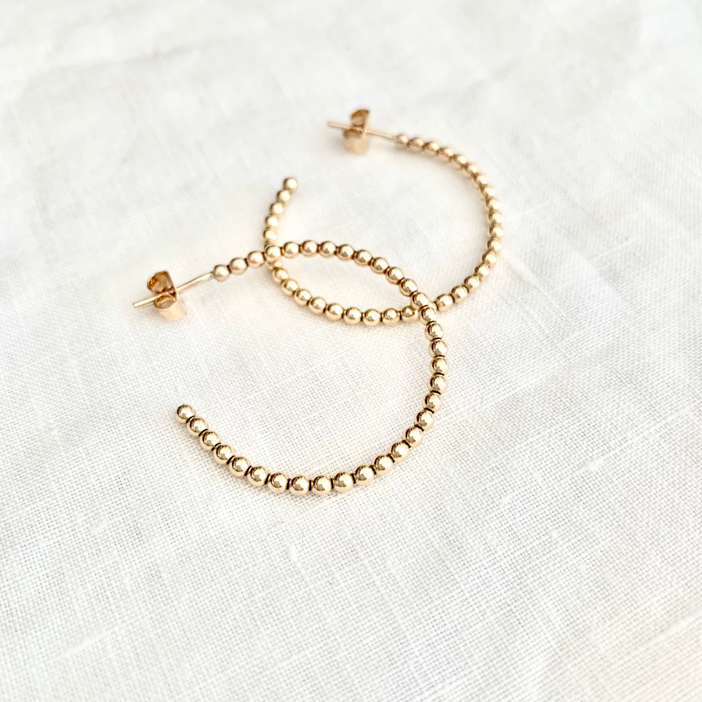 Lila beaded hoops